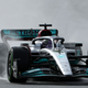 Lewis Hamilton drives his 2022 F1 car in the wet.